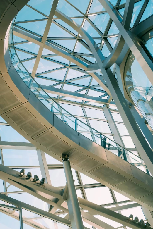 an abstract glass structure with multiple pillars and a circular glass roof