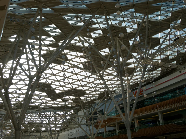 the inside of a mall looking towards an enclosed area with a ceiling