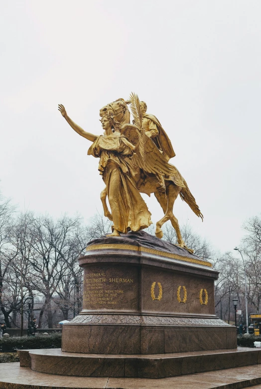 the large statue has gold details on it