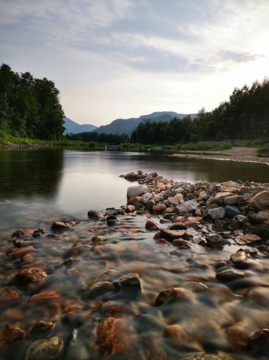 an image of a rocky river shore