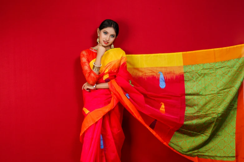 the young woman is posing with a big scarf