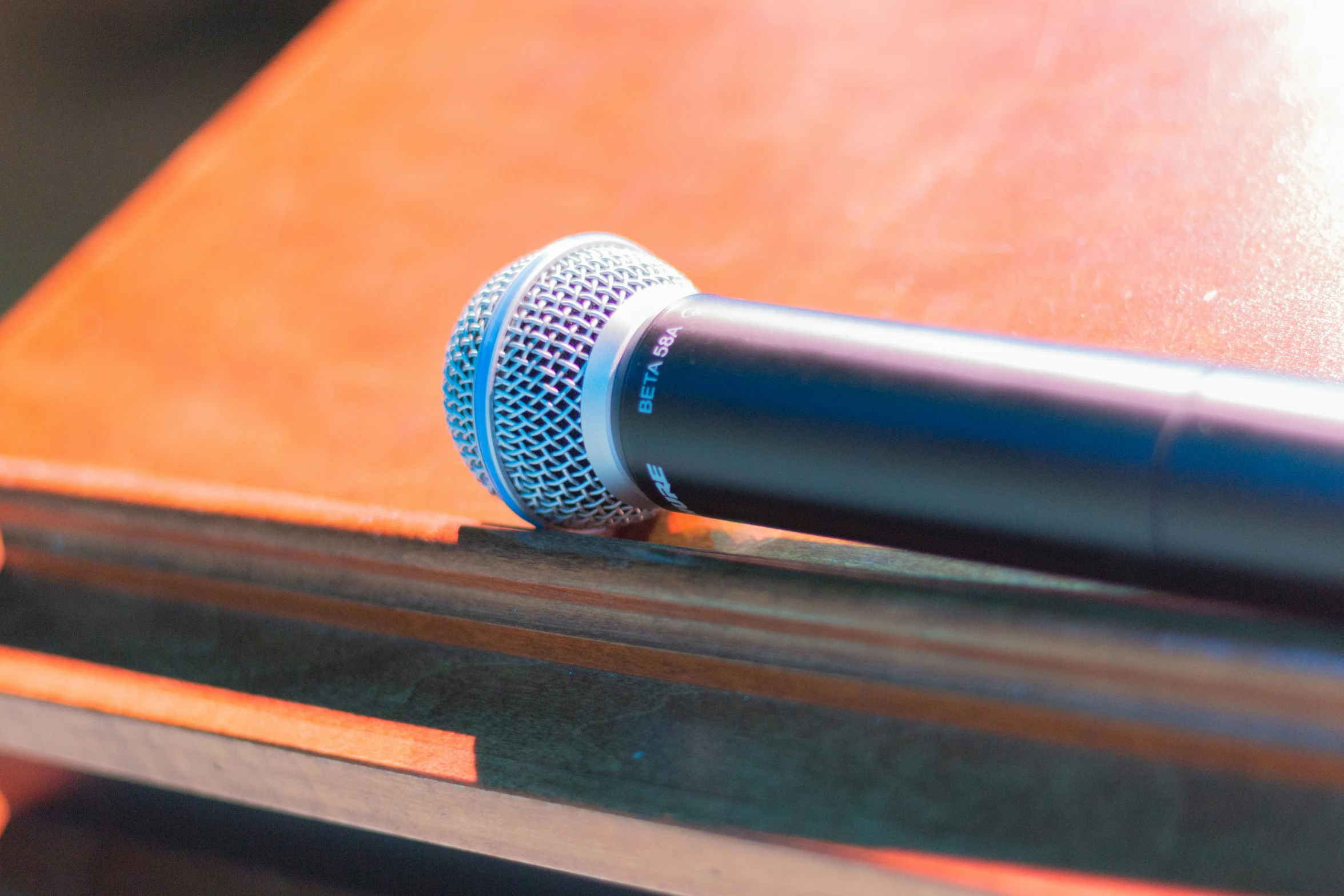 a microphone sitting on a table near a man