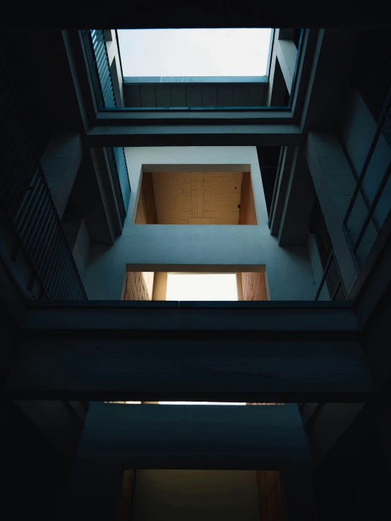 a modern building as seen from below with the floor exposed