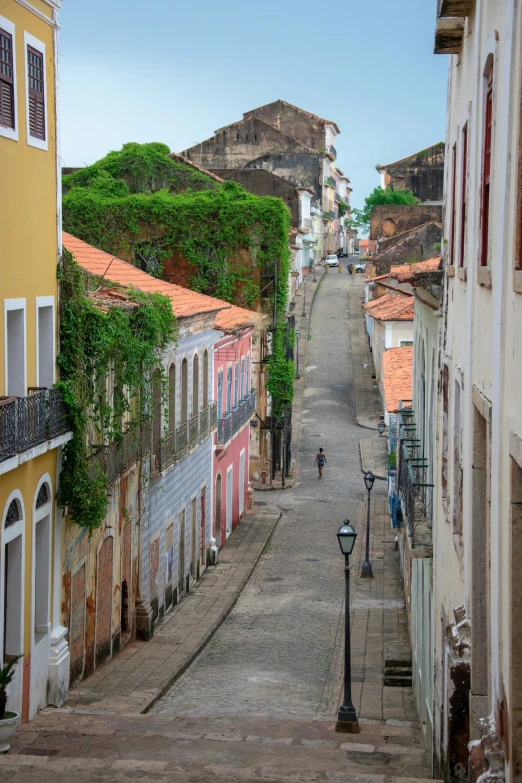 the street is lined with buildings along both sides of the road