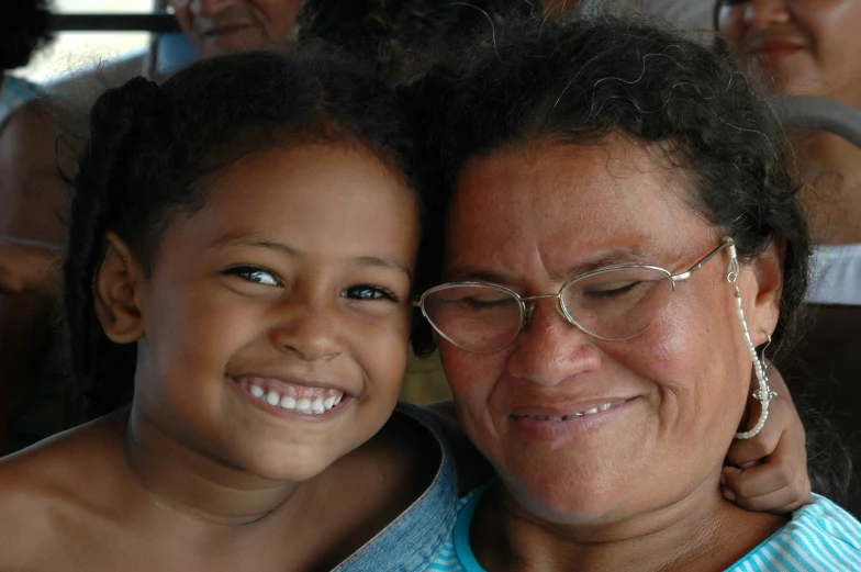 a woman and a child smile for the camera