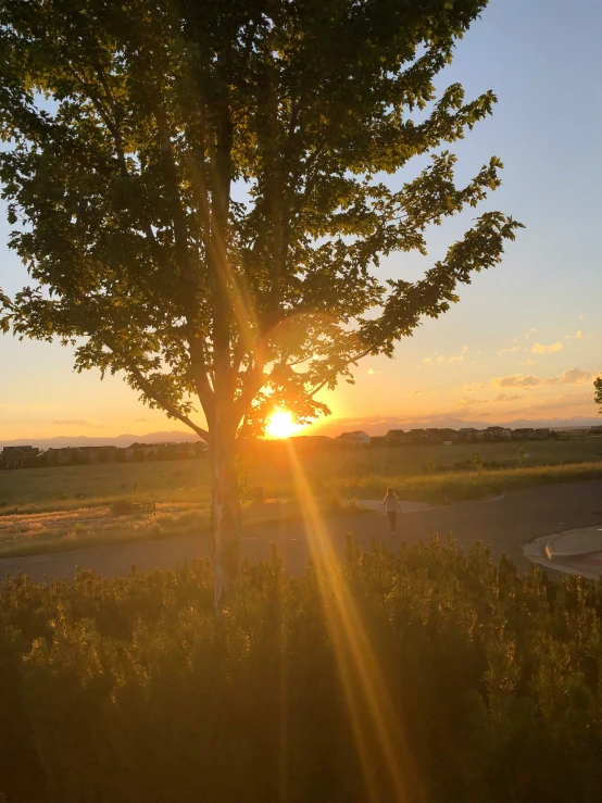 the sun is setting with the lens just slightly visible