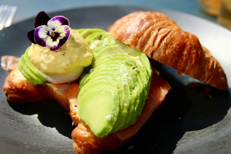 an avocado and some other food on a plate