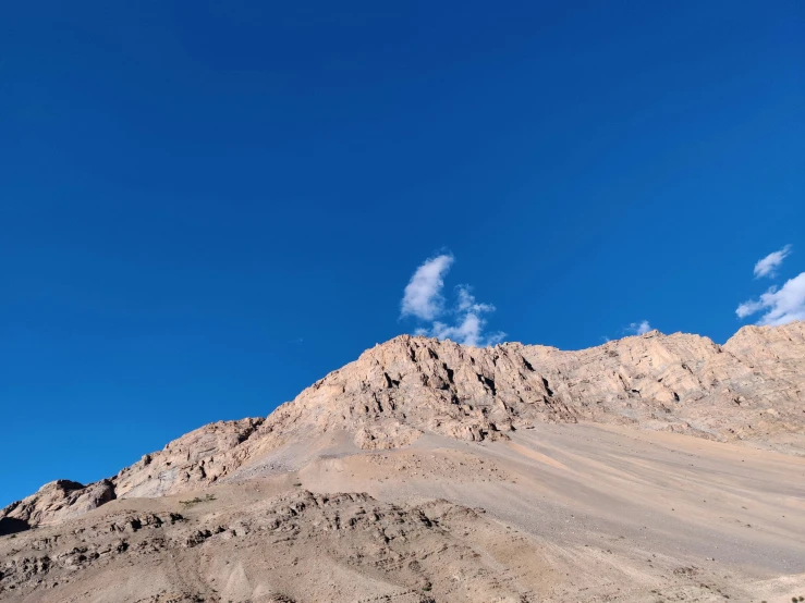 a very pretty mountain top against a blue sky