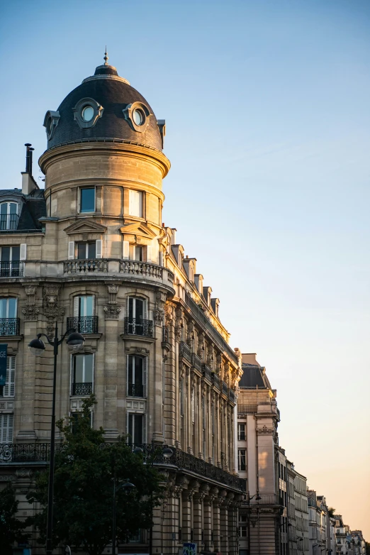 a building with a large dome in the middle of the street