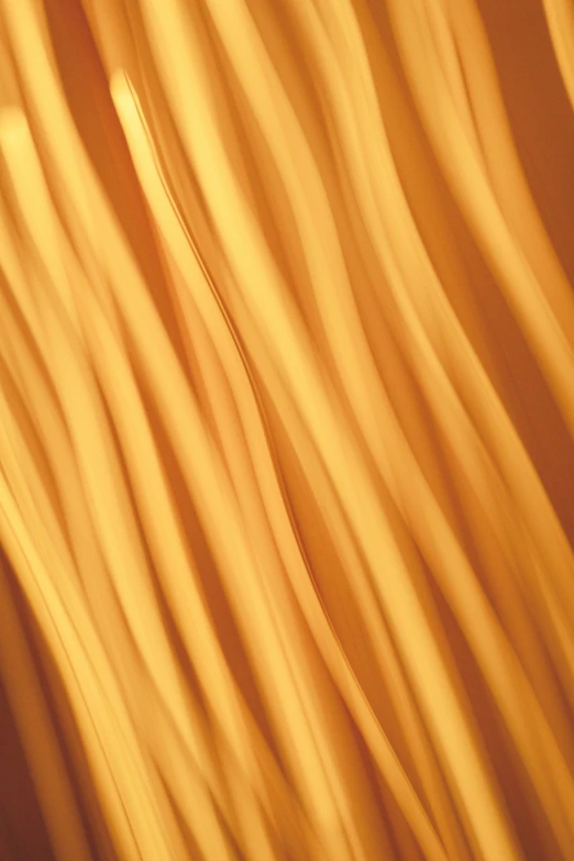 an abstract image with wavy orange hair on it