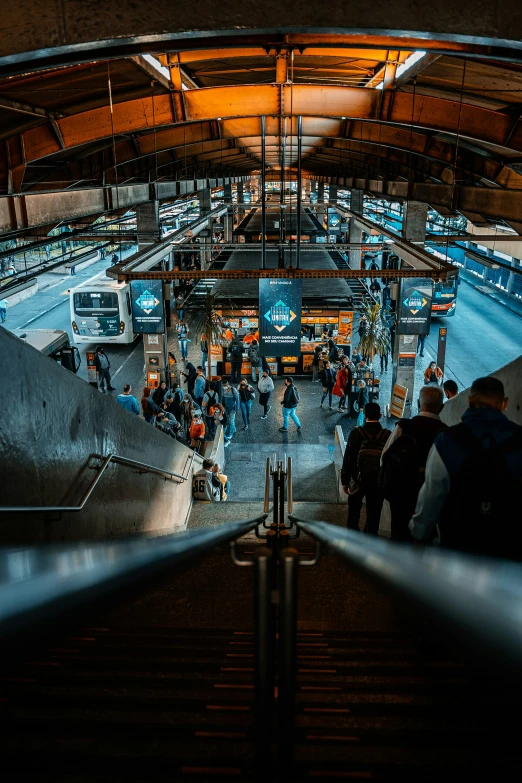 a large area with some stairs and people walking by