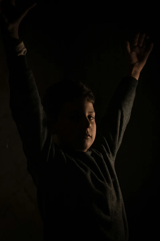 a woman poses for the camera while holding up her arms