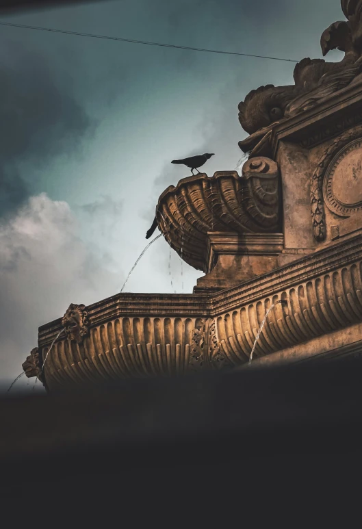 a tall building with a bird perched on top of it