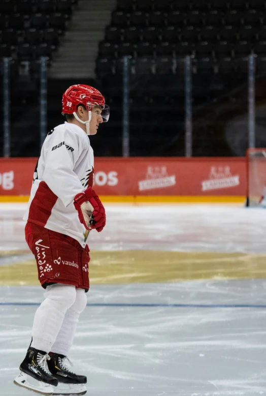 a young person riding on top of a hockey rink