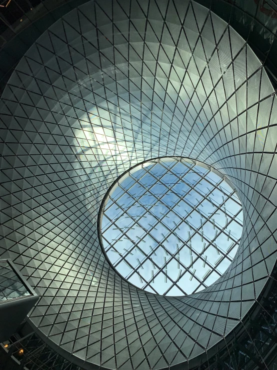 a circular looking building with a skylight