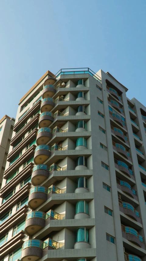 the tall building has balconies and a balcony