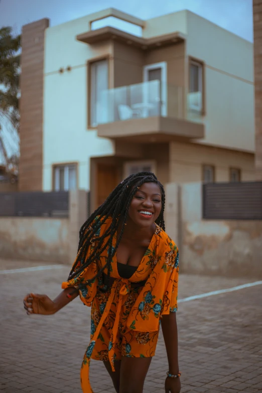 a woman is outside a house with long hair