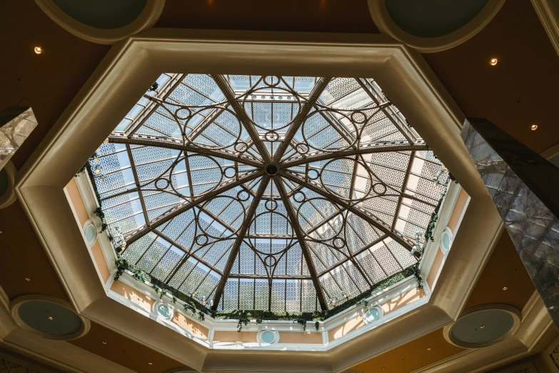 the top of an atrium has been lit with a ceiling light