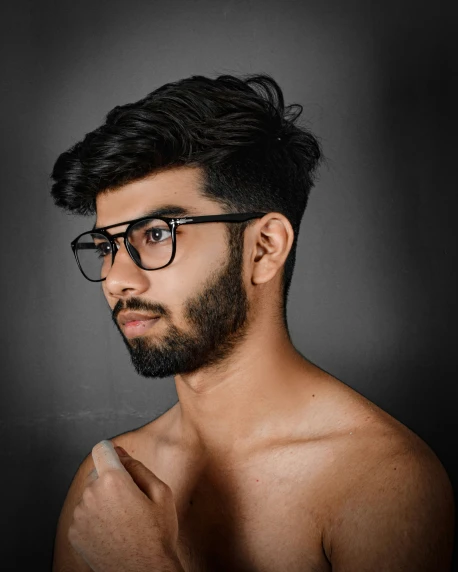 a man is in shirtless and glasses