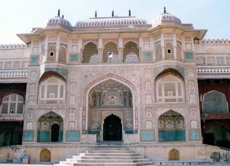 this beautiful indian structure features elaborately carved walls and windows