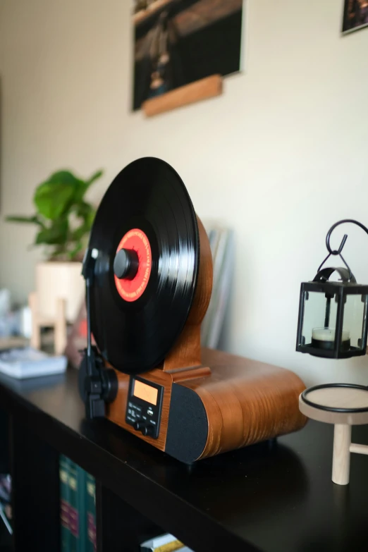 a record player is sitting on top of a bookshelf