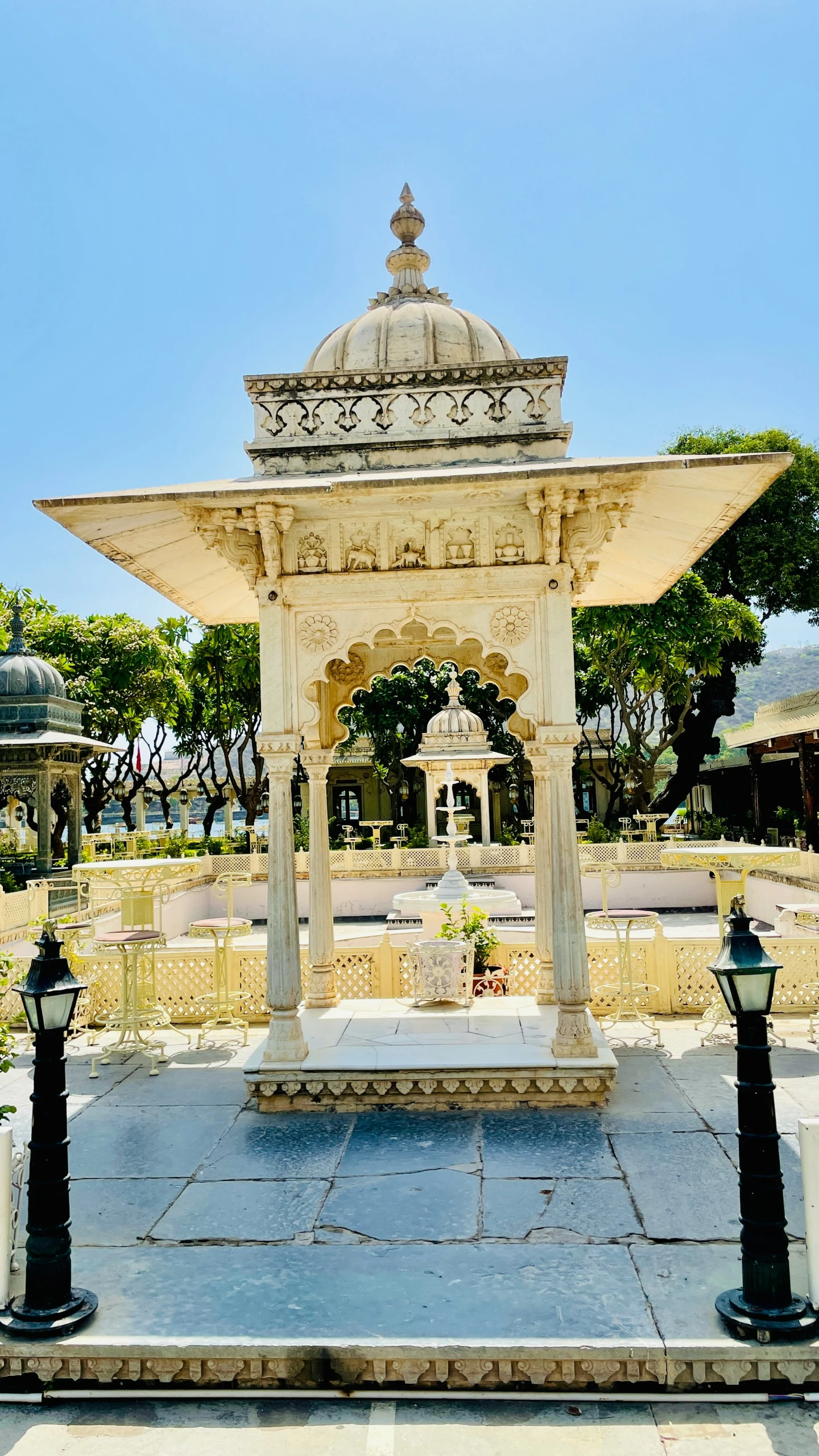 a white monument with pillars around it