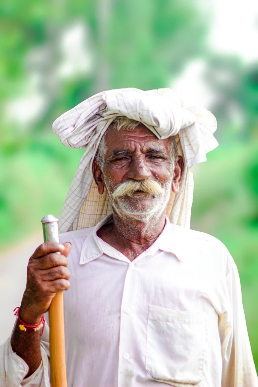 an old man wearing a white turban on top of his head