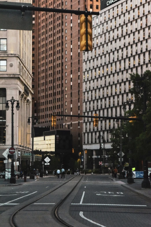 a crosswalk and train tracks in a big city