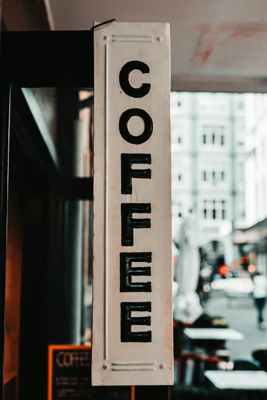 a sign is hung on a door to let people know what it is