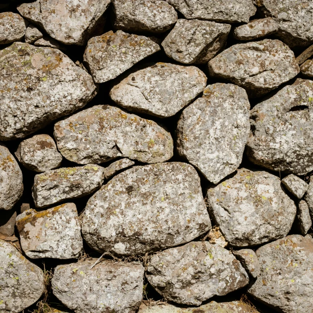 rocks in large pile sitting on grass