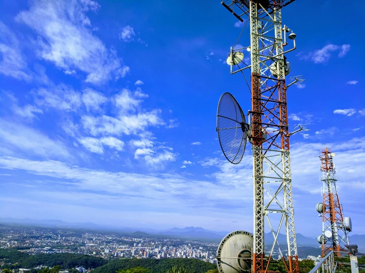 a radio mast is on top of a hill