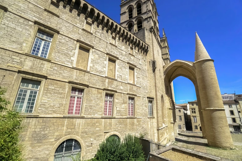 an old building has an arched tower