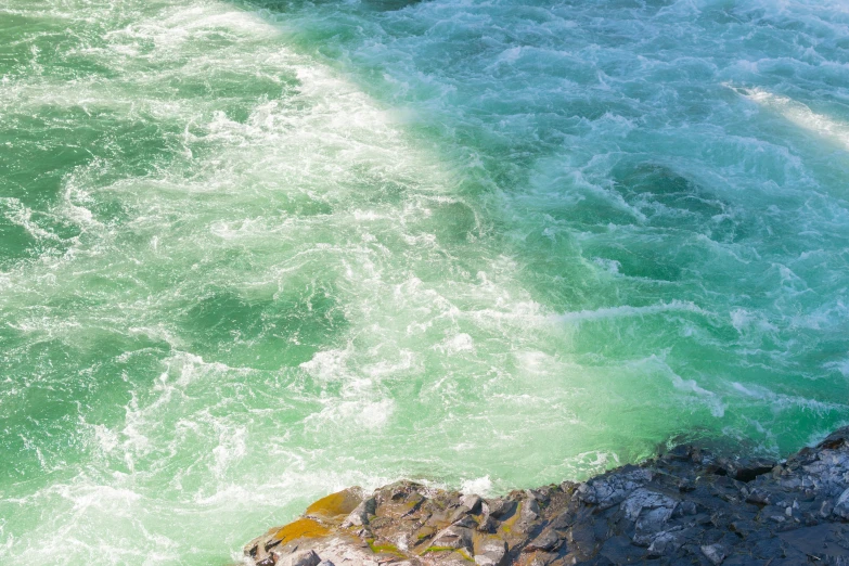 the water looks green and blue from above