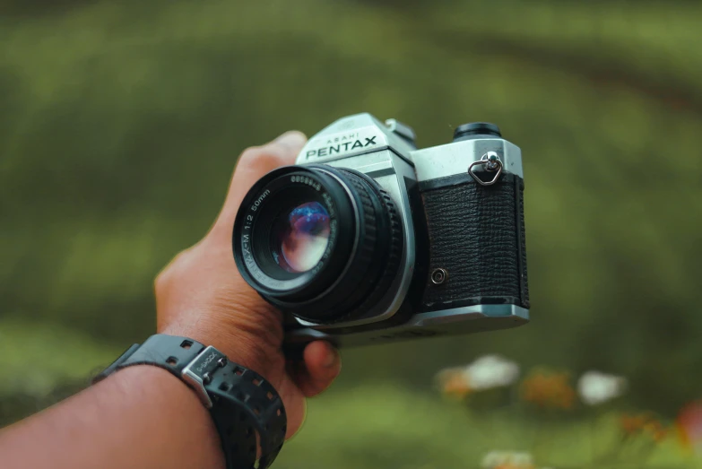 a person taking a pograph with a camera