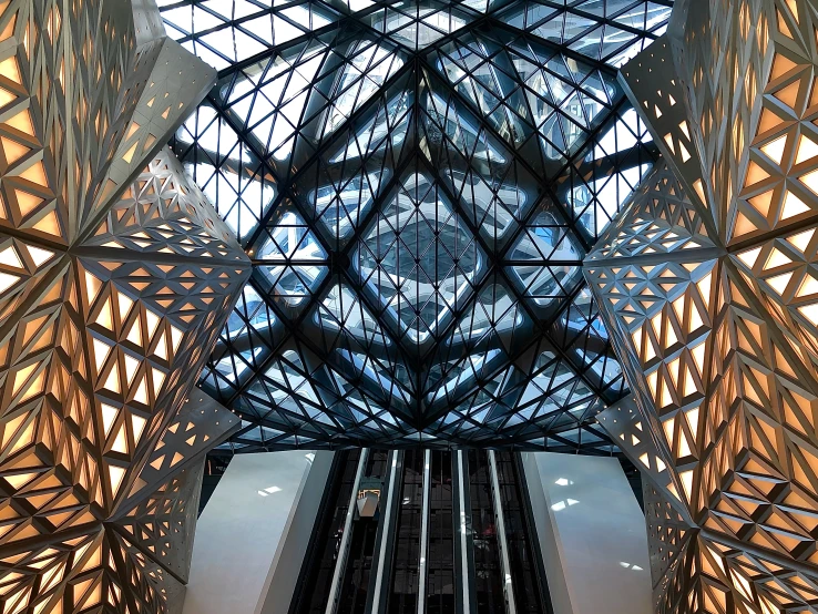 the ceiling of an atrium with lots of wooden slats