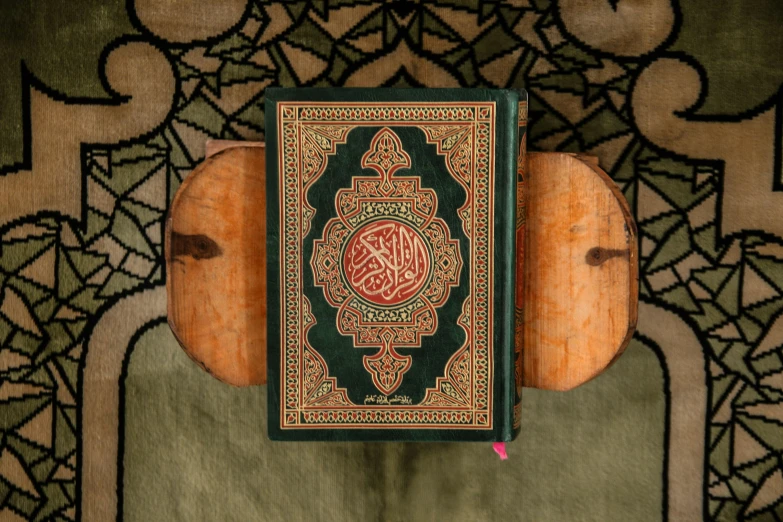 a book sitting on top of a wooden stand