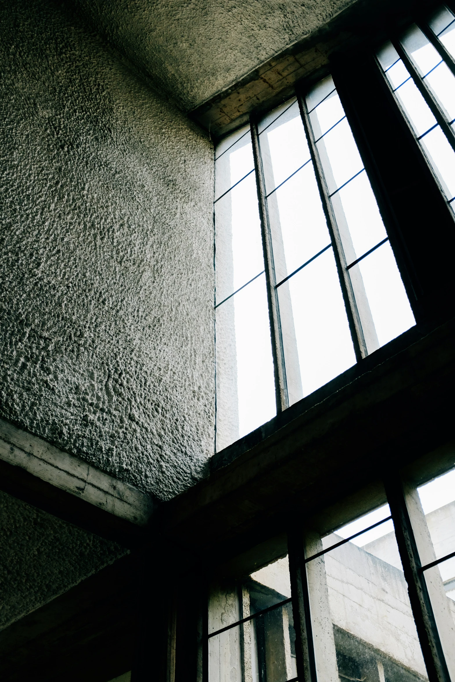 an open window in a grey building