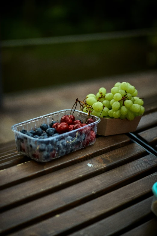 a bowl of gs, some berries and strawberries in it