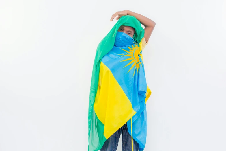 a woman poses in a blue and yellow sarong