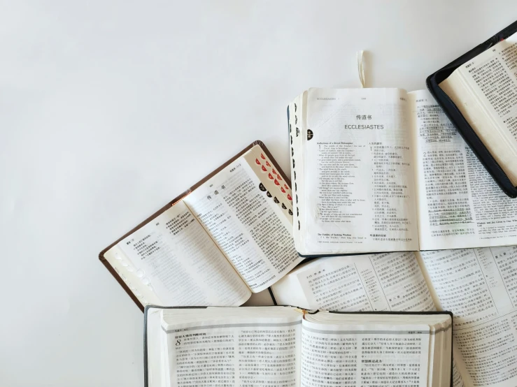 some open books are sitting together on the table