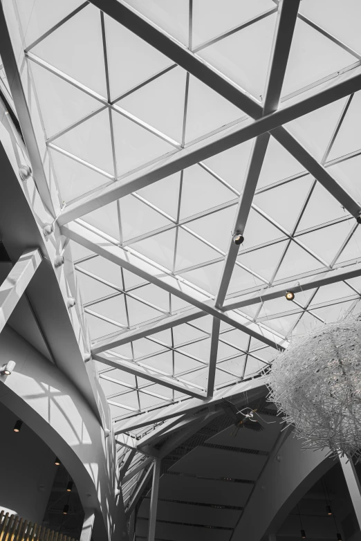 a glass ceiling in the inside of a building