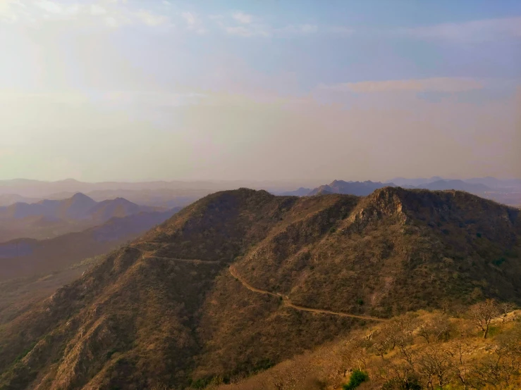 mountains in the background with a train moving along