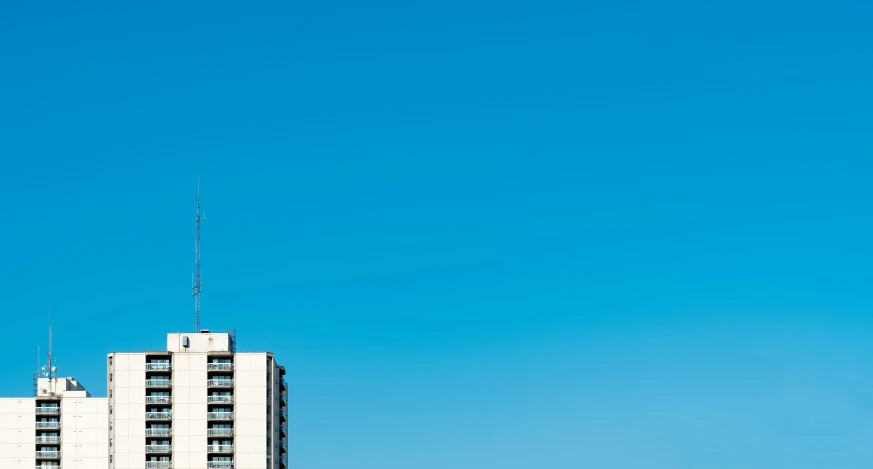 a view of a tall building from the bottom