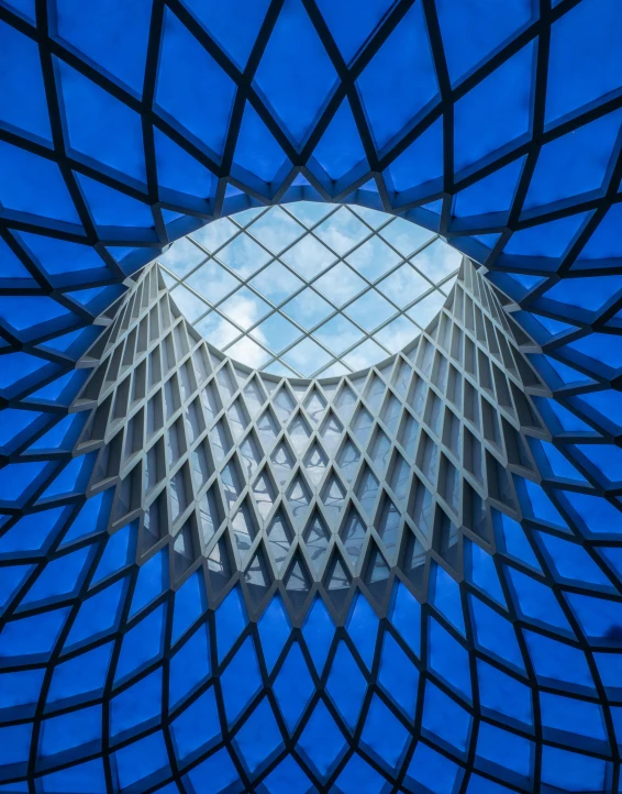 the ceiling inside the structure of a modern building