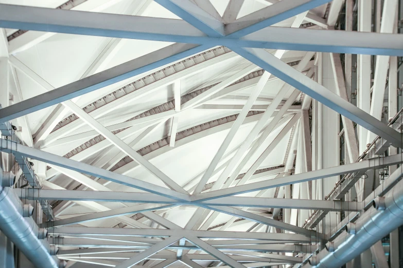 the interior of a very large room with metal and glass