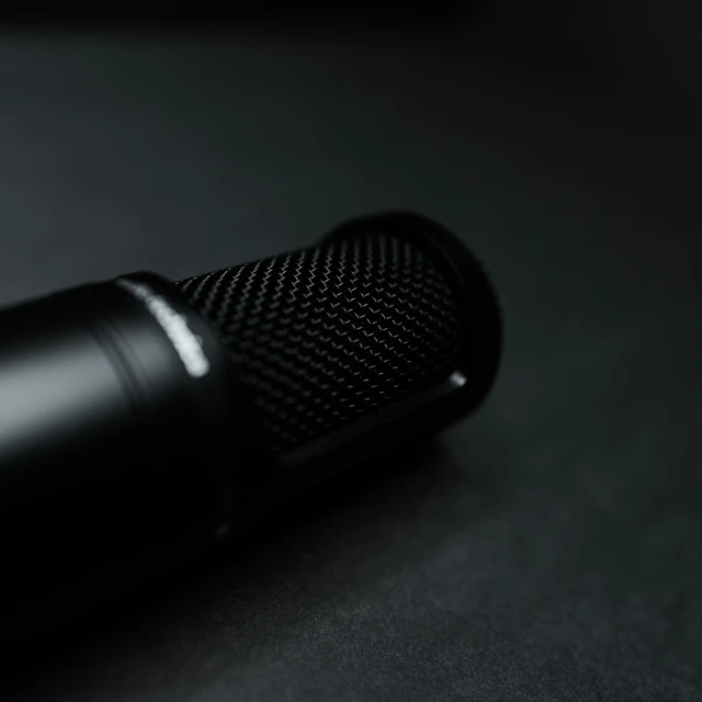 there is a microphone that is black and metallic