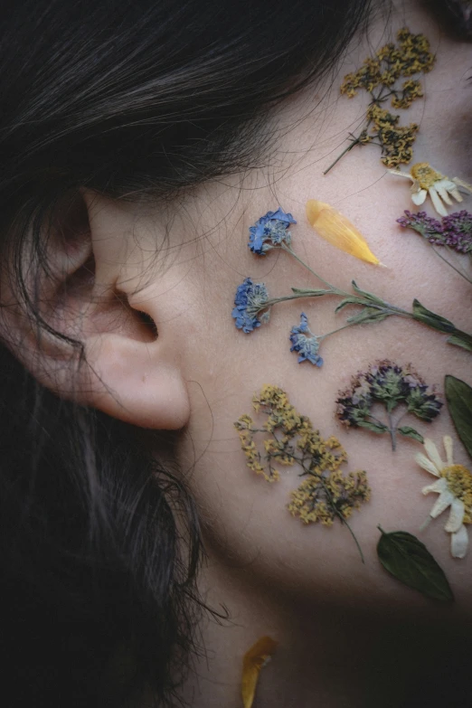 a person has a flower on her chest