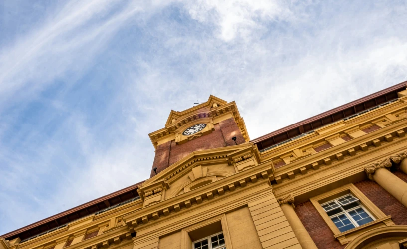 a building with two clocks built into the side of it