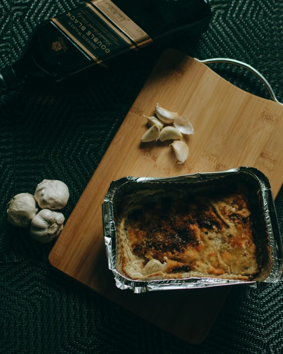 a piece of tin foil next to some mushrooms and other foods