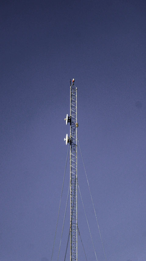 two airplanes flying high up on the top of a building